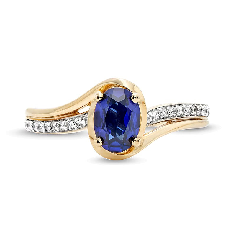 Oval Blue Lab-Created Sapphire and 0.1 CT. TW Diamond Bypass Ring in 10K Gold