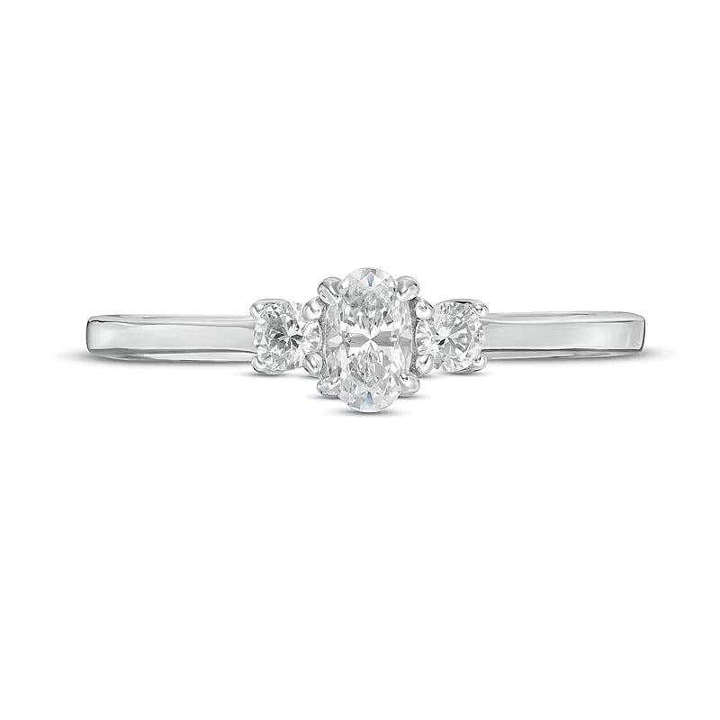 0.5 CT. TW Oval and Round Diamond Three Stone Engagement Ring in 14K White Gold