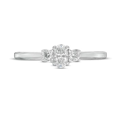 0.5 CT. TW Oval and Round Diamond Three Stone Engagement Ring in 14K White Gold