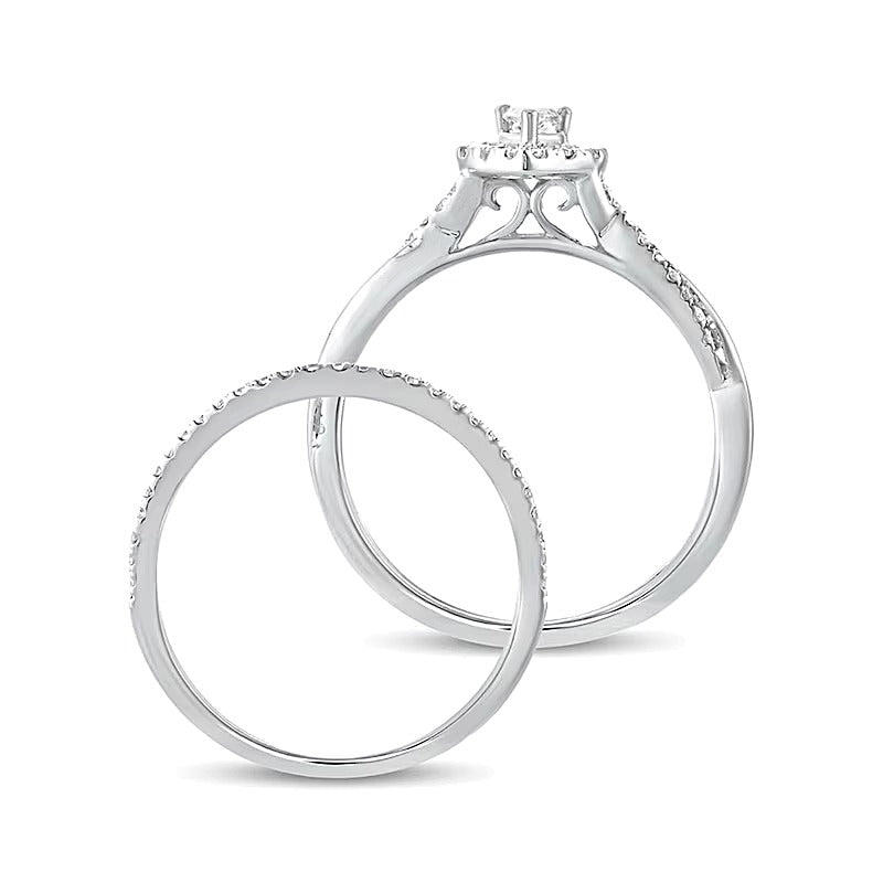 0.5 CT. TW Pear-Shaped Diamond Frame Twist Shank Bridal Set in 10K White Gold