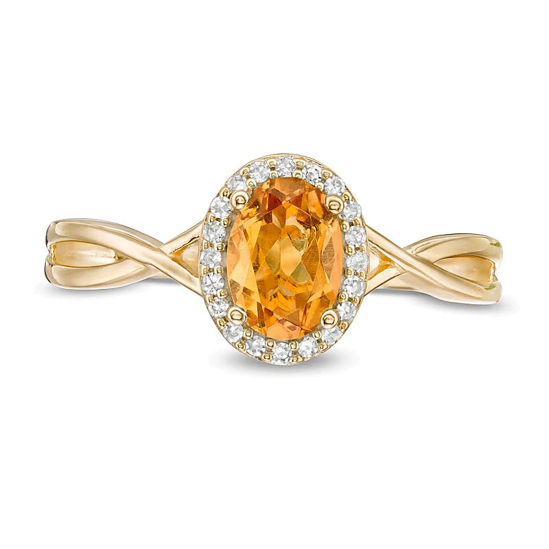 Oval Citrine and 0.07 CT. TW Diamond Frame Twist Shank Ring in 10K Gold