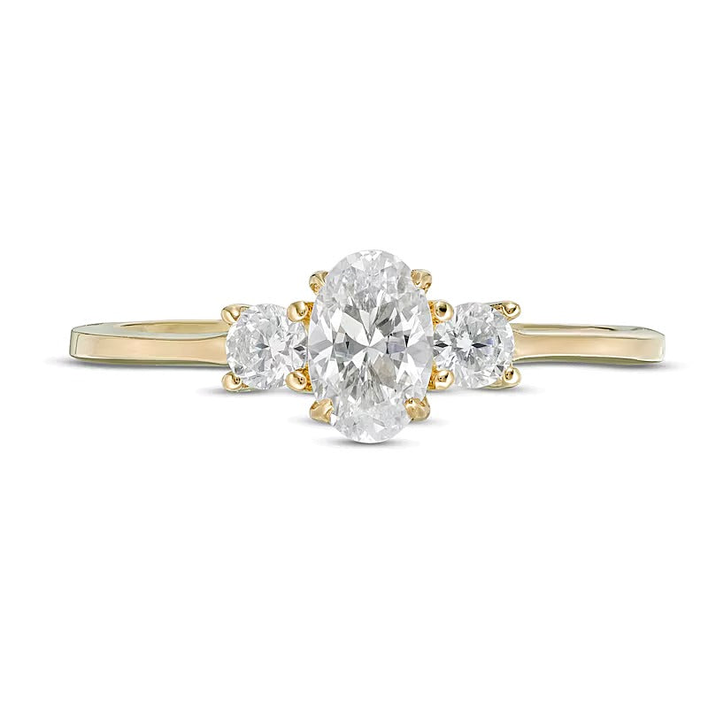 0.63 CT. TW Oval and Round Diamond Three Stone Engagement Ring in 14K Gold