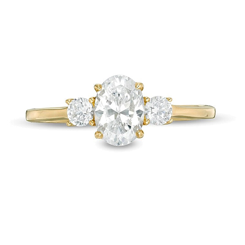 1.0 CT. TW Oval and Round Diamond Three Stone Engagement Ring in 14K Gold