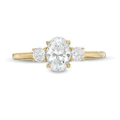 1.0 CT. TW Oval and Round Diamond Three Stone Engagement Ring in 14K Gold
