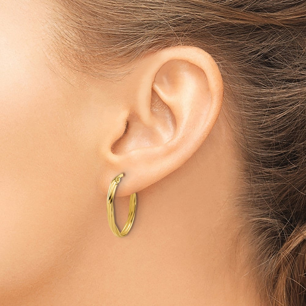 14K Yellow Gold Polished And Grooved Twist Oval Hoop Earrings