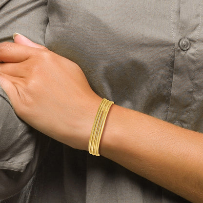 14K Yellow Gold Polished And Twisted 7 Layer Slip On Bangle