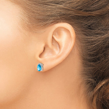 Sterling Silver Rhodium Plated Oval Blue Topaz And Diamond Post Earrings