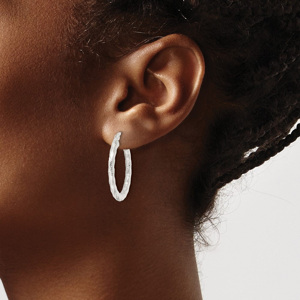 Sterling Silver Polished And Textured Twisted Hoop Earrings