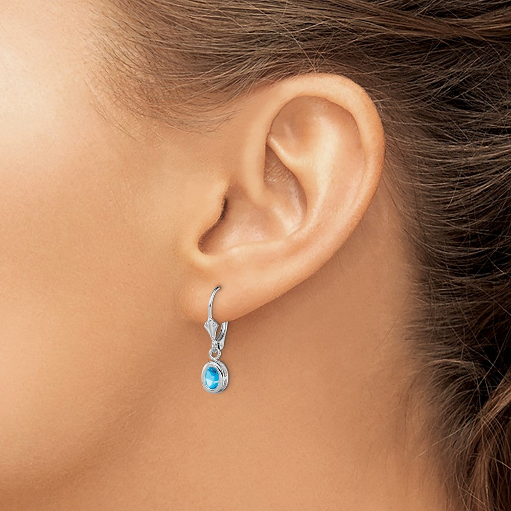 Sterling Silver Rhodium Plated 6X4mm Oval Blue Topaz Leverback Earrings