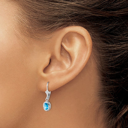 Sterling Silver Rhodium Plated 7X5mm Oval Blue Topaz Leverback Earrings
