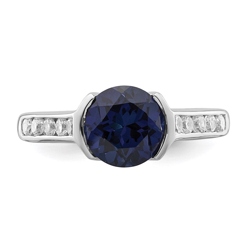 Sterling Silver Rhodium Plated Synthetic Blue Sapphire And Cz Bezel Ring