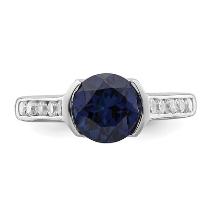Sterling Silver Rhodium Plated Synthetic Blue Sapphire And Cz Bezel Ring