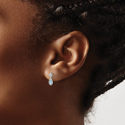 Sterling Silver Rhodium Plated White Ice .02ct. Dia. and Blue Topaz Post Earrings