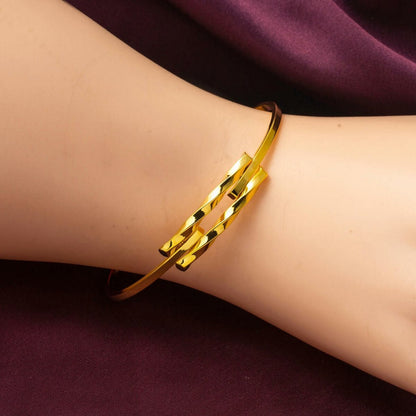 14K Yellow Gold Twisted Minimalist Ribbed Bangle
