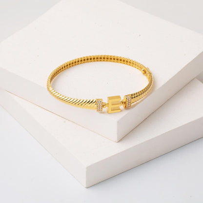 14K Yellow Gold E Initial Twisted Cubic Zirconia Hinged Cuff Bangle