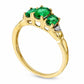 Oval Lab-Created Emerald and Diamond Accent Three Stone Ring in Solid 10K Yellow Gold