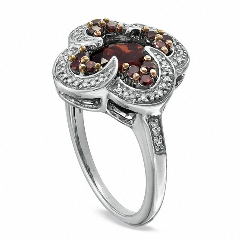 Oval Garnet and 0.33 CT. T.W. Enhanced Red and White Natural Diamond Ring in Sterling Silver