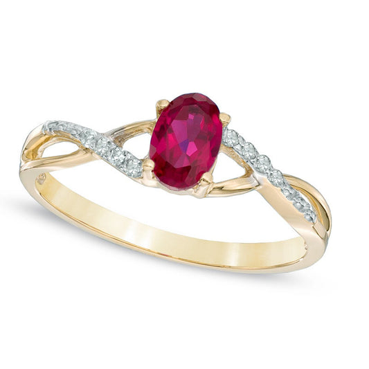Oval Lab-Created Ruby and Diamond Accent Twist Engagement Ring in Solid 10K Yellow Gold