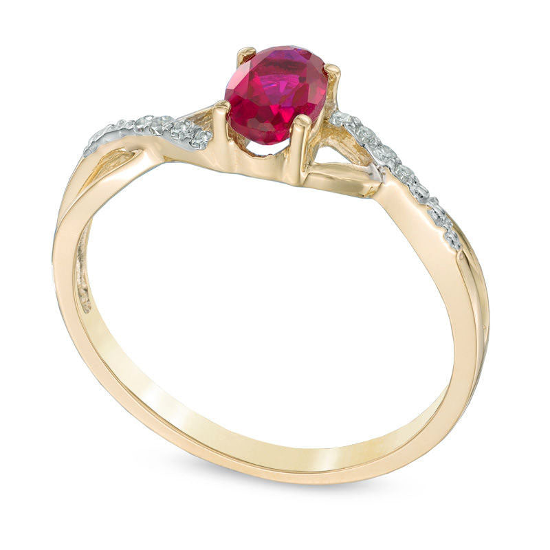 Oval Lab-Created Ruby and Diamond Accent Twist Engagement Ring in Solid 10K Yellow Gold