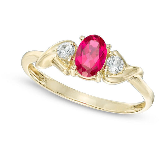 Oval Lab-Created Ruby and White Topaz Ring in Solid 10K Yellow Gold