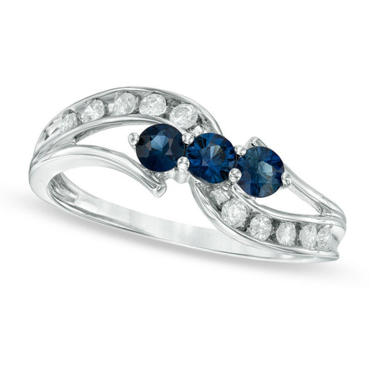 Blue Sapphire and 0.20 CT. T.W. Natural Diamond Three Stone Bypass Ring in Solid 10K White Gold