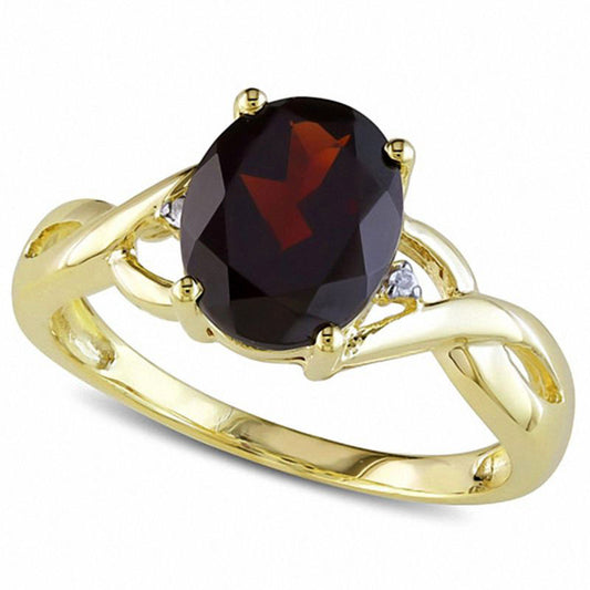 Oval Garnet and Natural Diamond Accent Bypass Ring in Solid 10K Yellow Gold