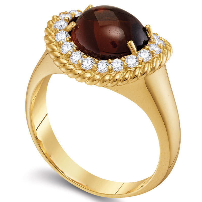 Oval Garnet and 0.38 CT. T.W. Natural Diamond Rope Frame Ring in Solid 10K Yellow Gold