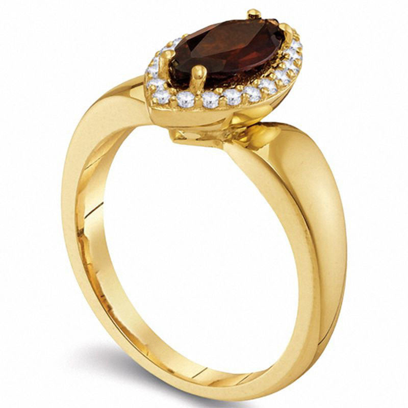 Marquise Garnet and 0.20 CT. T.W. Natural Diamond Frame Ring in Solid 10K Yellow Gold
