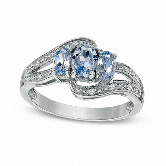 Oval Simulated Aquamarine and Lab-Created White Sapphire Three Stone Bypass Ring in Sterling Silver