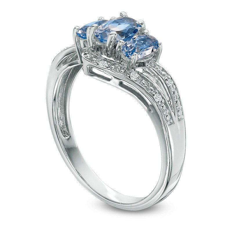 Oval Simulated Aquamarine and Lab-Created White Sapphire Three Stone Bypass Ring in Sterling Silver