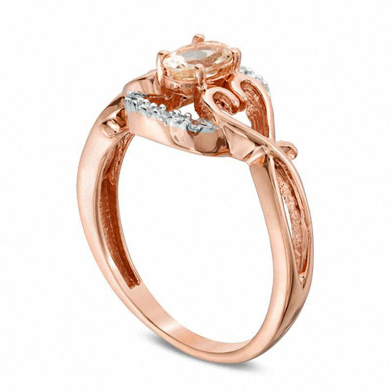 Oval Morganite and Natural Diamond Accent Twisting Heart Sides Ring in Solid 10K Rose Gold
