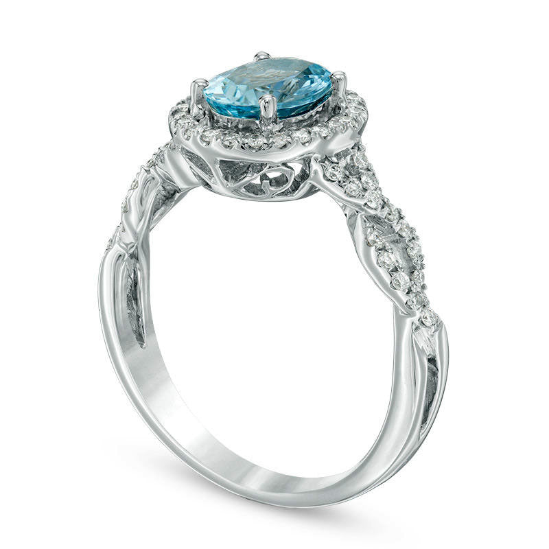 Oval Aquamarine and 0.20 CT. T.W. Natural Diamond Frame Twist Shank Ring in Solid 14K White Gold - Size 7