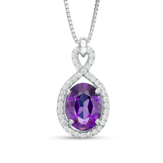 Oval Amethyst and White Topaz Frame Pendant in Sterling Silver