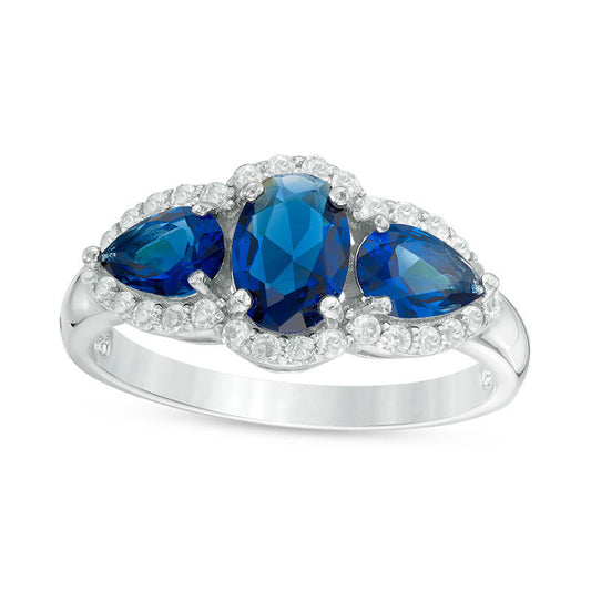 Oval and Pear-Shaped Lab-Created Blue Sapphire with White Topaz Frame Three Stone Ring in Sterling Silver