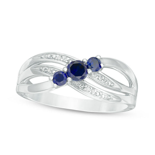 Lab-Created Blue Sapphire and Diamond Accent Three Stone Crossover Ring in Sterling Silver