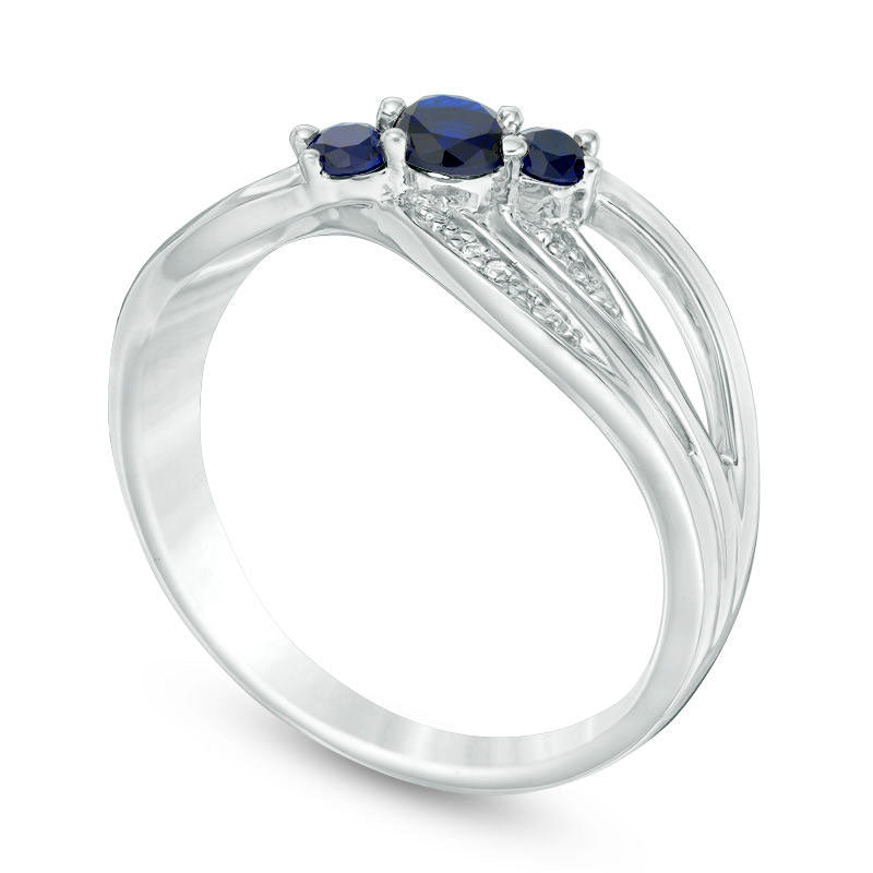 Lab-Created Blue Sapphire and Diamond Accent Three Stone Crossover Ring in Sterling Silver