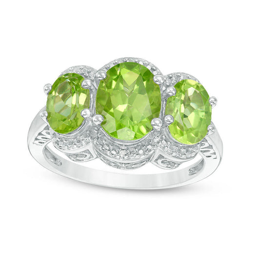 Oval Peridot and Natural Diamond Accent Three Stone Frame Ring in Sterling Silver
