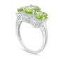 Oval Peridot and Natural Diamond Accent Three Stone Frame Ring in Sterling Silver