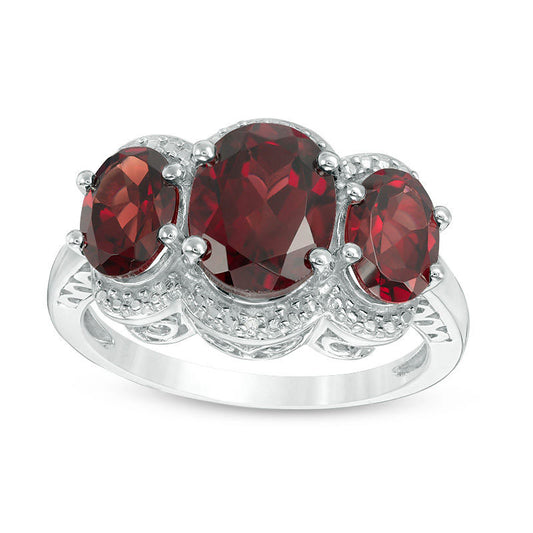Oval Garnet and Natural Diamond Accent Three Stone Frame Ring in Sterling Silver