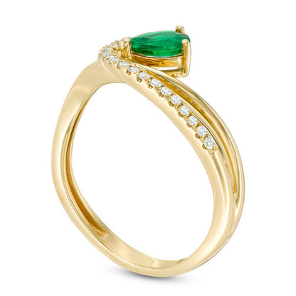 Pear-Shaped Emerald and 0.10 CT. T.W. Natural Diamond Swirl Bypass Ring in Solid 14K Gold