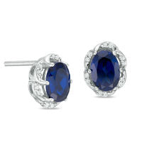 Oval Lab-Created Blue Sapphire and 0.1 CT. T.W. Diamond Frame Stud Earrings in Sterling Silver