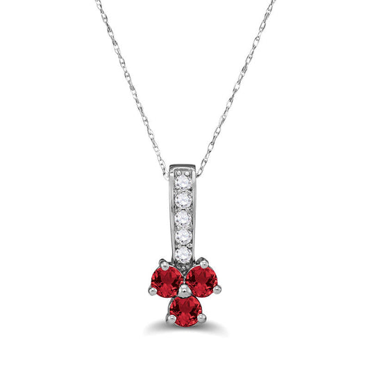 Lab-Created Ruby and 0.13 CT. T.W. Diamond Trio Pendant in Sterling Silver