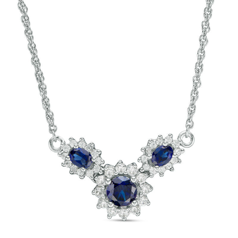 Oval and Round Lab-Created Blue and White Sapphire Sunburst Frame Three Stone Necklace in Sterling Silver