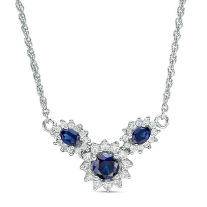 Oval and Round Lab-Created Blue and White Sapphire Sunburst Frame Three Stone Necklace in Sterling Silver