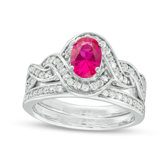 Oval Lab-Created Ruby and 0.50 CT. T.W. Diamond Braided Frame Bridal Engagement Ring Set in Sterling Silver