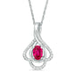 Oval Lab-Created Ruby and 0.17 CT. T.W. Diamond Teardrop Frame Leaf Pendant in 10K White Gold