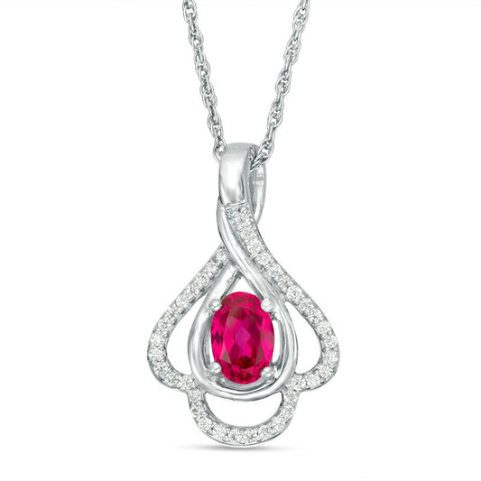 Oval Lab-Created Ruby and 0.17 CT. T.W. Diamond Teardrop Frame Leaf Pendant in 10K White Gold