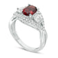Oval Garnet, White Topaz and 0.25 CT. T.W. Natural Diamond Three Stone Frame Crossover Shank Ring in Solid 10K White Gold