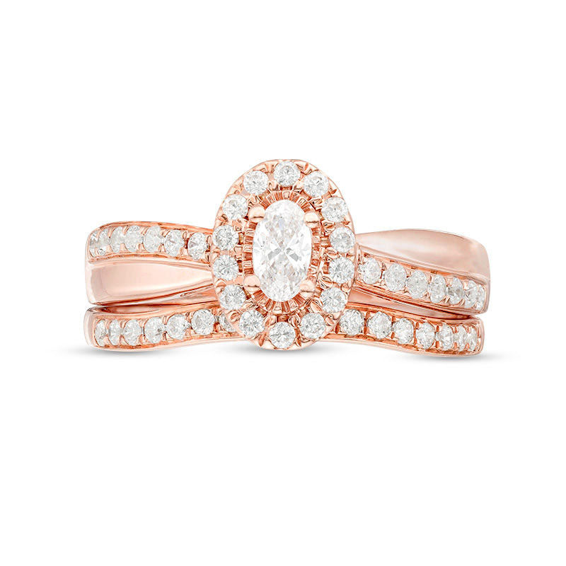 0.75 CT. T.W. Oval Natural Diamond Frame Crossover Bridal Engagement Ring Set in Solid 14K Rose Gold