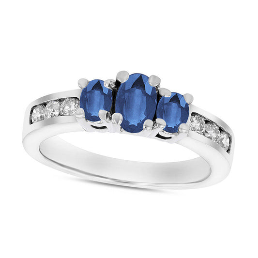 Oval Blue Sapphire and 0.33 CT. T.W. Natural Diamond Channel Three Stone Engagement Ring in Solid 14K White Gold